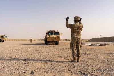 A U.S. Army autonomous vehicle is unloaded by soldiers at Camp Buehring, Kuwait, on June 26, 2023.