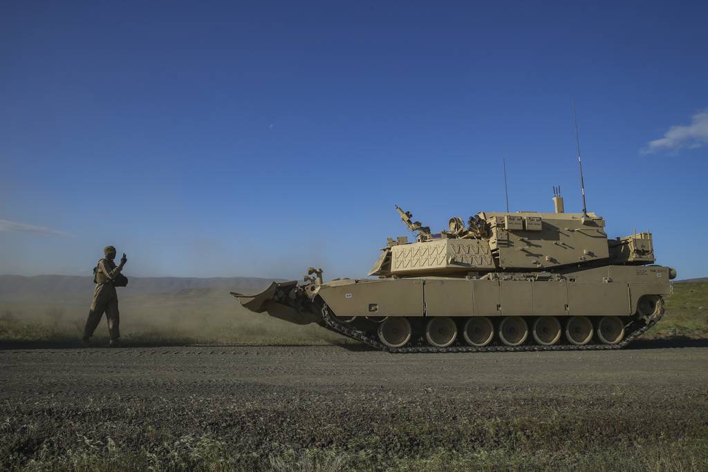 U.S. Marines conduct maintenance on Assault Breacher Vehicles during the Robotic Complex Breach Concept on Yakima Training Center in Yakima, Washington, in 2019.