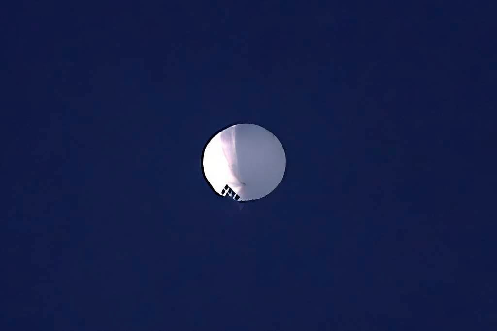 A high altitude balloon floats over Billings, Mont., on Wednesday, Feb. 1, 2023. The huge, high-altitude Chinese balloon sailed across the U.S. on Friday, drawing severe Pentagon accusations of spying and sending  excited or alarmed Americans outside with binoculars.